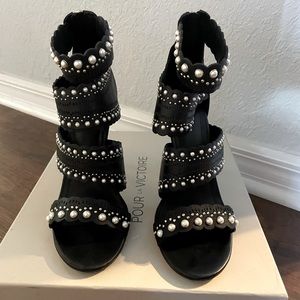 Black sandals with pearls and silver studs